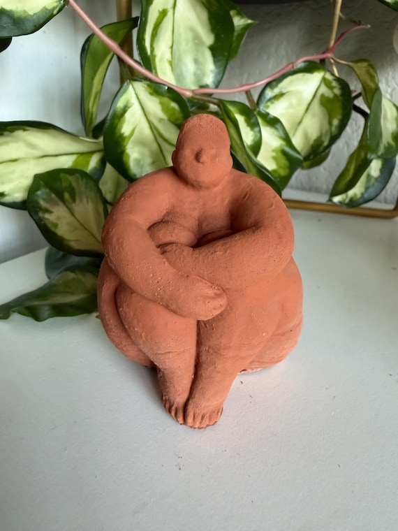 Sitting concrete abstract lady book end