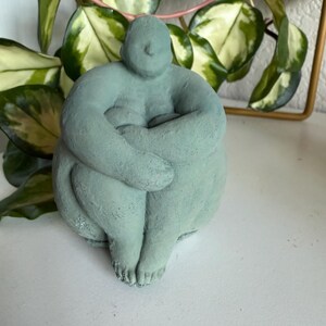 Sitting concrete abstract lady book end image 2