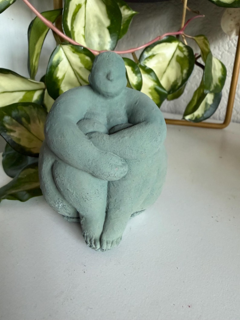 Sitting concrete abstract lady book end image 2