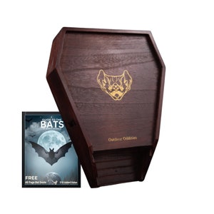 May include: A wooden coffin-shaped box with a bat silhouette on the front. The box is labeled "Outdoor Oddities" and includes a free 40-page guide to the bats of North America.