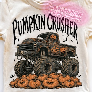 May include: A cream-colored t-shirt featuring a graphic of a monster truck with a pumpkin driver and skull accents. The text PUMPKIN CRUSHER is printed above the truck, which is driving over a pile of orange pumpkins. The design includes bats.