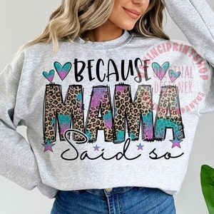 May include: A gray sweatshirt with the text "Because Mama Said So" in pink, blue, and black letters with a leopard print design. The text is surrounded by pink and blue hearts and stars.