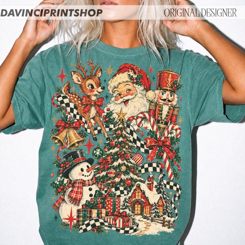 May include: A teal short-sleeve t-shirt featuring a vintage-style Christmas graphic. The design includes a reindeer, Santa Claus, a nutcracker, a snowman, a decorated tree, gifts, and candy canes. The text DAVINCIPRINTSHOP and ORIGINAL DESIGNER appears.