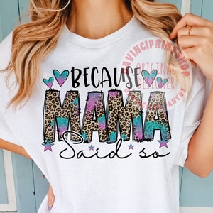 May include: White t-shirt with the text "Because Mama said so" in pink, blue, and black with a leopard print background. The text is surrounded by hearts and stars.