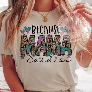May include: White t-shirt with the text "Because Mama Said So" in pink, blue, and brown with a leopard print design.