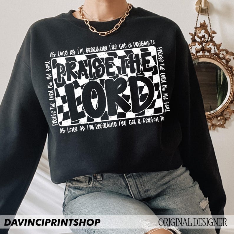 May include: Black sweatshirt with a white checkered design and the text "Praise The Lord Oh, My Soul" and "As Long As I'm Breathing I've Got a Reason To" repeated on the front.