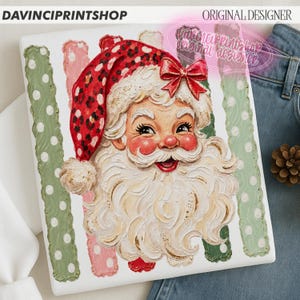 May include: A rectangular print featuring a painted Santa Claus with a thick white beard, rosy cheeks, and a red hat with a black leopard print pattern and a red bow. The background includes vertical stripes in sage green and pink with white polka dots.