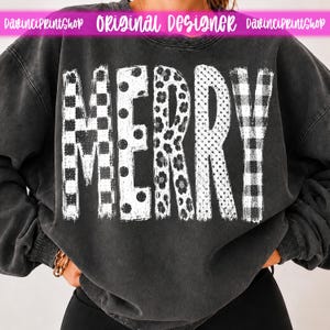 May include: A charcoal gray mineral-washed sweatshirt featuring the word MERRY in large white letters. Each letter has a distinct pattern: a checkerboard, polka dots, floral print, small dots, and a buffalo plaid pattern across the front.