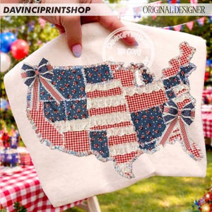May include: A white fabric item featuring a patchwork design in the shape of the United States. The design incorporates red gingham, blue floral patterns, and white ruffled accents. Two decorative bows are placed on the design. The text "DAVINCIPRINTSHOP" and "ORIGINAL DESIGNER" are visible.