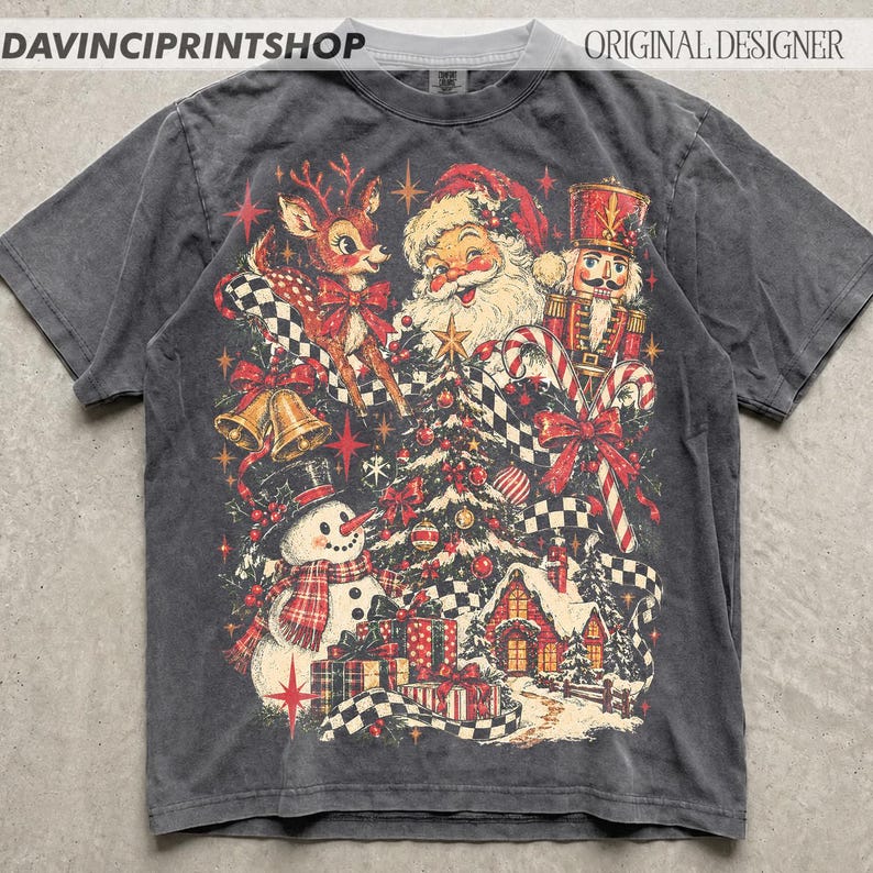 May include: A charcoal gray short-sleeve t-shirt featuring a vintage-style Christmas graphic. The design includes a reindeer, Santa Claus, a nutcracker, a snowman, a decorated tree, gifts, and candy canes with a black and white checkered ribbon.
