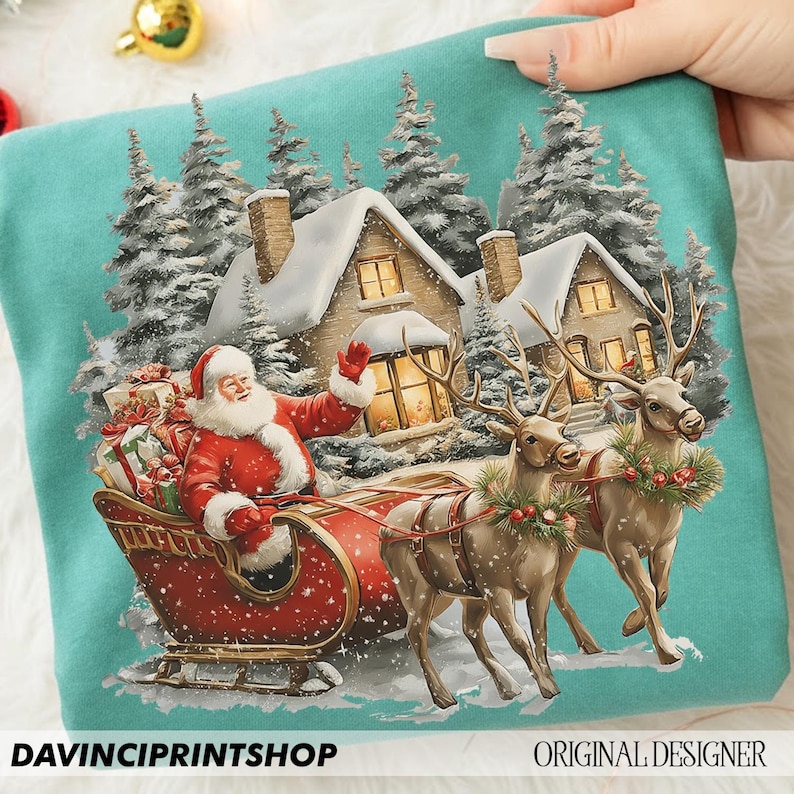 May include: A teal sweatshirt with a festive Christmas design. It depicts Santa Claus in a red sleigh, pulled by reindeer, with snow-covered houses and pine trees in the background. The text "DAVINCIPRINTSHOP" and "ORIGINAL DESIGNER" are visible.