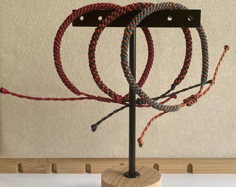 Hand braided nylon cord adjustable bracelet.