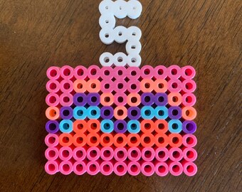 Birthday cake decor made from perler beads.