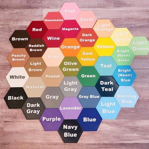 May include: A colour chart with 25 different paint colours displayed in hexagon shapes. The colours include pink, coral, light orange, red, magenta, dark orange, yellow, light green, brown, wine, orange, dark yellow, teal, light brown, olive green, green, bright neon green, white, peanut, light grey, natural, grey, grey blue, morning blue, dark grey, lavender, purple, blue, navy blue.