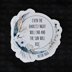 May include: White sticker with a blue watercolour moon and floral design. The text reads "Even the darkest night will end and the sun will rise" with "Victor Hugo" at the bottom.