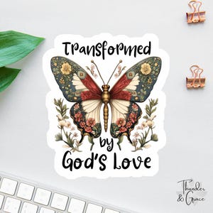 May include: A white sticker with a colorful butterfly and the text "Transformed by God's Love".