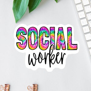 May include: A sticker with the word "SOCIAL" in rainbow tie-dye letters and the word "worker" in black script.