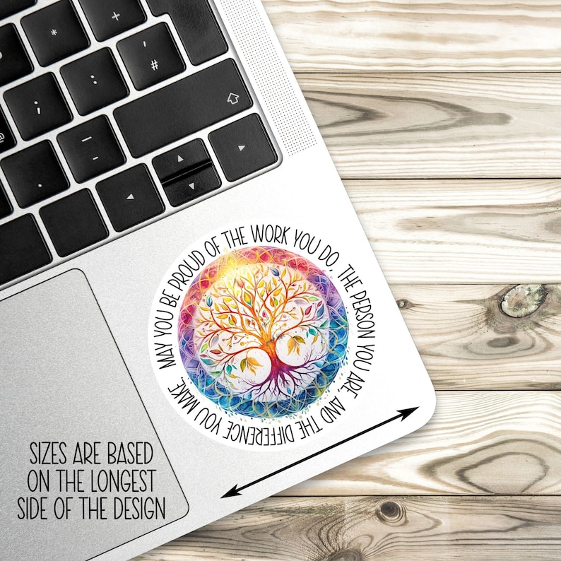 May include: A colorful sticker with a tree of life design and the text "May you be proud of the work you do. The person you are, and the difference you make."