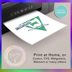 May include: A digital download of a logo for a company called "Yoyodyne Propulsion Systems". The logo is a green triangle with a blue silhouette of a rocket inside. The text "Print at Home, or Costco, CVS, Walgreens, Walmart or many others" is below the logo.