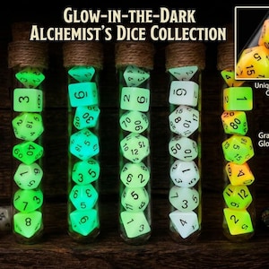 May include: Five glass test tubes filled with polyhedral dice, labeled Glow-in-the-Dark Alchemist's Dice Collection. The tubes contain various dice shapes with black numbers, including green glow-in-the-dark and yellow-to-green gradient sets.