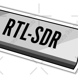 May include: A gray and black USB stick with a yellow antenna. The text "RTL-SDR" is printed on the stick.