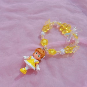 Pulsera/llavero vintage con dije Kandi de girasol de Sakura Cardcaptor