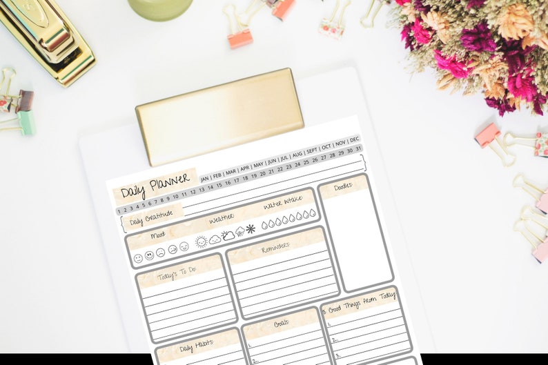 May include: A printable daily planner with sections for daily gratitude, mood, weather, water intake, today's to do, reminders, daily habits, goals, and good things from today. The planner has a beige background with grey lines and text.