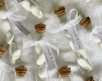 Wedding almonds in a test tube as a guest gift