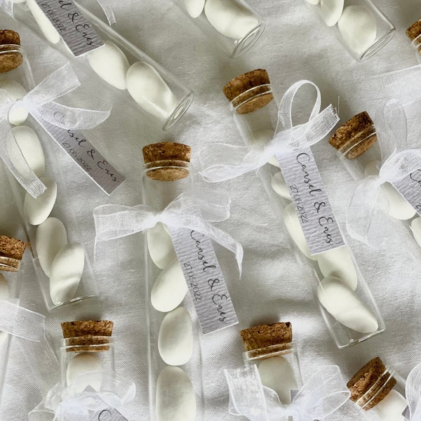 Wedding almonds in a test tube as a guest gift