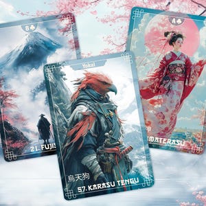 May include: Three playing cards with Japanese-inspired artwork. One card depicts a geisha, another a mountain scene, and the third a bird-like creature. The cards have a light blue border and the text "Yokai", "MATERASU", and "57. KARASU TENGU".