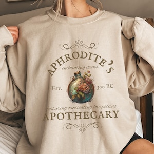 Aphrodites Apothecary Sweatshirt | Goddess Sweatshirt | Potions Crewneck | Love Potions | Greek Goddess Sweatshirt | Greek Mythology Shirt
