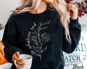 May include: Black sweatshirt with a white floral design and the text "to whatever end" printed on the front.