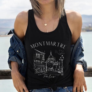 May include: Black tank top with a white graphic of a Parisian street scene with the text "Montmartre Paris".