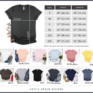 Puede incluir: Camiseta gris oscuro con tabla de tallas y opciones de color. La tabla muestra medidas de pecho de 46 cm a 71 cm y largos de 71 cm a 84 cm. Las opciones de color incluyen blanco, rosa y azul marino.