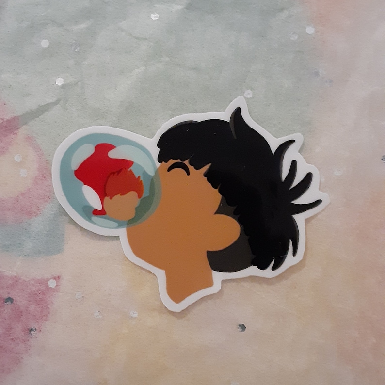 May include: A sticker of a cartoon character blowing a bubble with a red fish inside. The character has black hair and is wearing a white shirt.