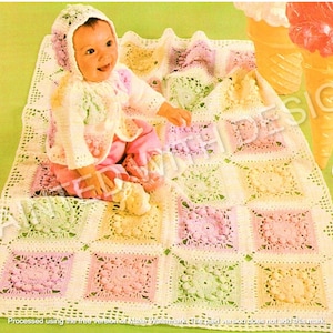 May include: A baby wearing a crocheted hat and matching sweater sits on a crocheted blanket with a pastel color scheme. The blanket is made of squares with a floral design.