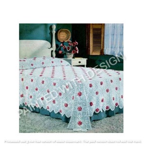 May include: A white crocheted bedspread with a floral design. The bedspread has a scalloped edge and is decorated with red crocheted flowers.