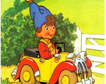 May include: A Noddy book cover illustration featuring the character Noddy in a blue hat with a bell, driving a yellow and red car. The text reads NODDY at the top and 5 Knitting patterns at the bottom, set against a green landscape.