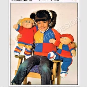 May include: A girl wearing a blue and red checked sweater with a yellow collar holds two Cabbage Patch Kids dolls. One doll is wearing a red and yellow outfit and the other is wearing a blue and red outfit. The dolls are sitting on a wooden rocking chair.