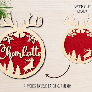 May include: A 4 inch wooden Christmas ornament with a reindeer and snowflakes design. The ornament is laser cut and ready to be personalized with the name "Charlotte".