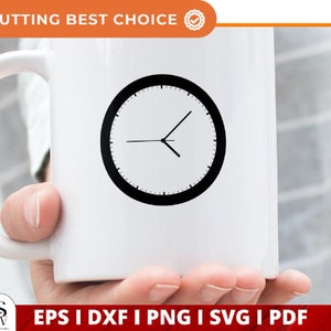 May include: A white ceramic mug with a black clock face design. The mug is being held by a hand.