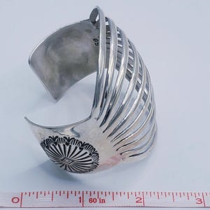 May include: A set of three ceramic mugs with a speckled, matte finish. The mugs are in shades of cream, light gray, and dark gray. Each mug has a simple, modern design and a rounded handle.