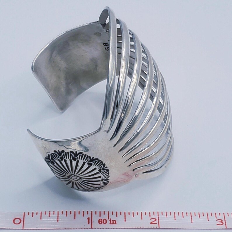 May include: A set of three ceramic mugs with a speckled, matte finish. The mugs are in shades of cream, light gray, and dark gray. Each mug has a simple, modern design and a rounded handle.