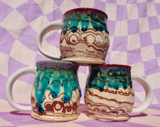 Handmade psychedelic mug with marbled clay