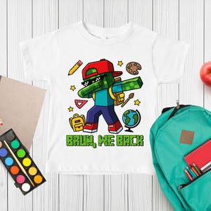 May include: A white t-shirt featuring a graphic of a pixelated green character wearing a red cap and sunglasses, performing a dab pose. The design includes school supplies like a pencil, globe, and backpack, with the text BRUH, WE BACK in green.