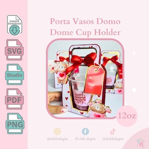 May include: A Valentine's Day dome cup holder with a red bow and a tag. The cup holder contains a clear plastic cup with the words "Happy Valentine's Day". The holder is decorated with hearts and a teddy bear. The cup is 355 ml.