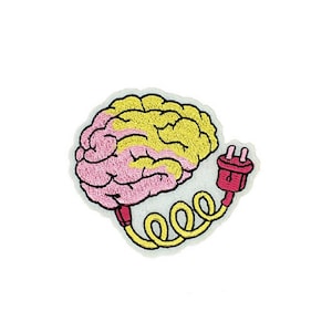 May include: Embroidered patch featuring a cartoon brain in pink and yellow, connected to a red plug with a yellow cord. The patch has a white border and is set against a white background. Ideal for jackets, bags, or other fabric items.