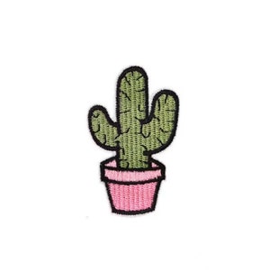 May include: Embroidered patch of a green cactus in a pink pot. The cactus has a textured appearance with detailed stitching. The pot is a solid pink with a black outline. The patch is designed to be ironed on or sewn onto fabric.