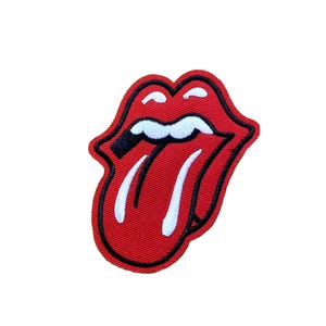 May include: Embroidered patch featuring the iconic red lips and tongue logo with a black outline. The tongue is white, and the lips are a vibrant red. This patch is a classic symbol of rock and roll.