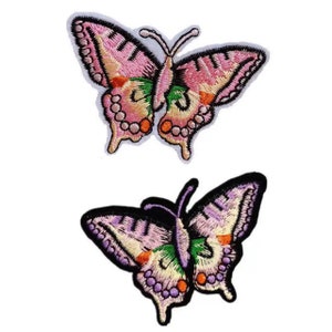 May include: Two embroidered butterfly patches. One is pink with green and orange accents. The other is purple with green and orange accents.